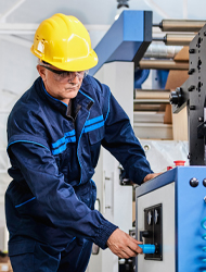 a factory employee checking on equipment