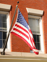 an American flag hanging on a building