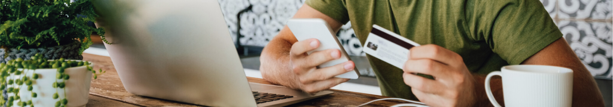 a person making a mobile purchase with debit/credit card