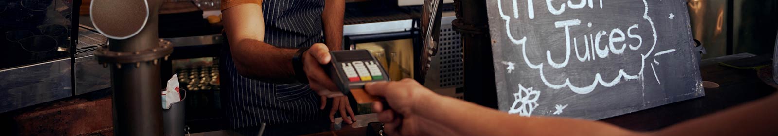 a person paying for a purchase using a credit/debit card