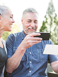 a couple making a mobile deposit