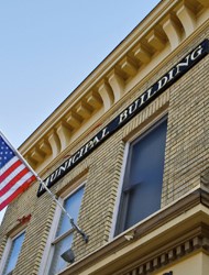 municipal building with an American flag