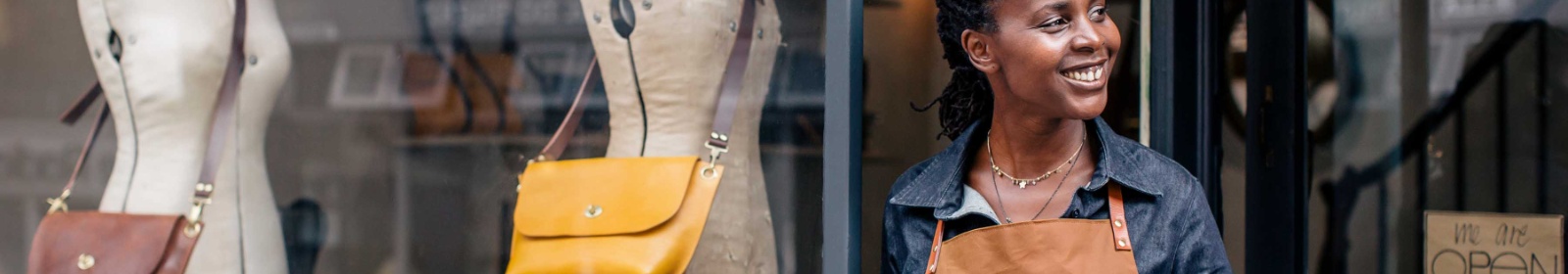 a woman posing in front of her small business