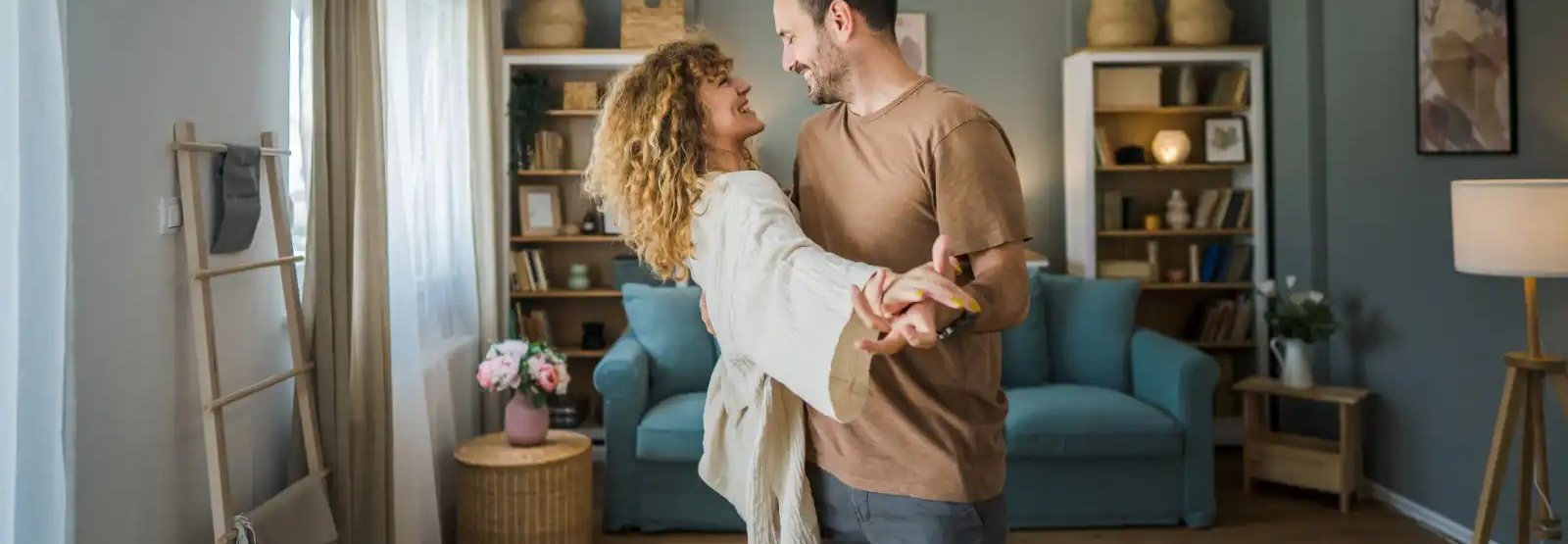 a couple dancing in their living room