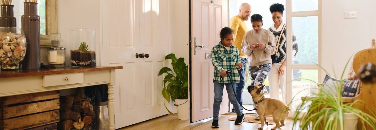 a family walking into their new home